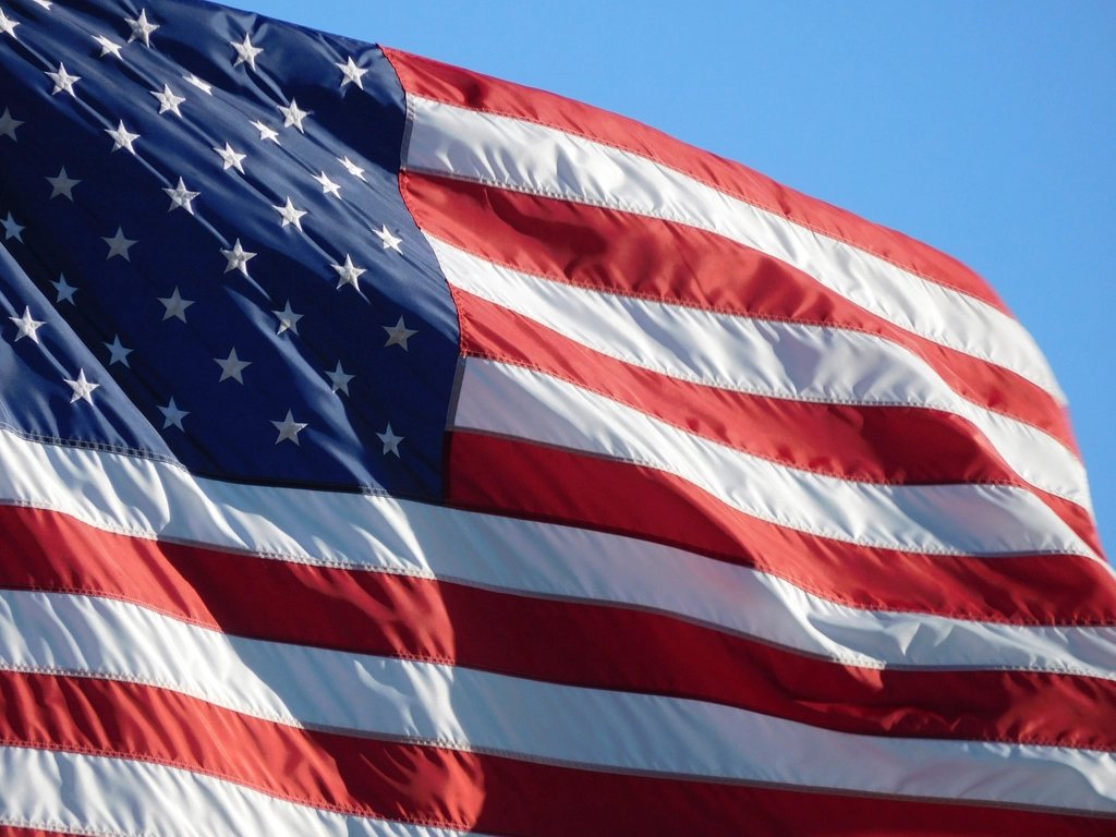 Close-up of a waving American flag, symbolizing U.S. citizenship and naturalization