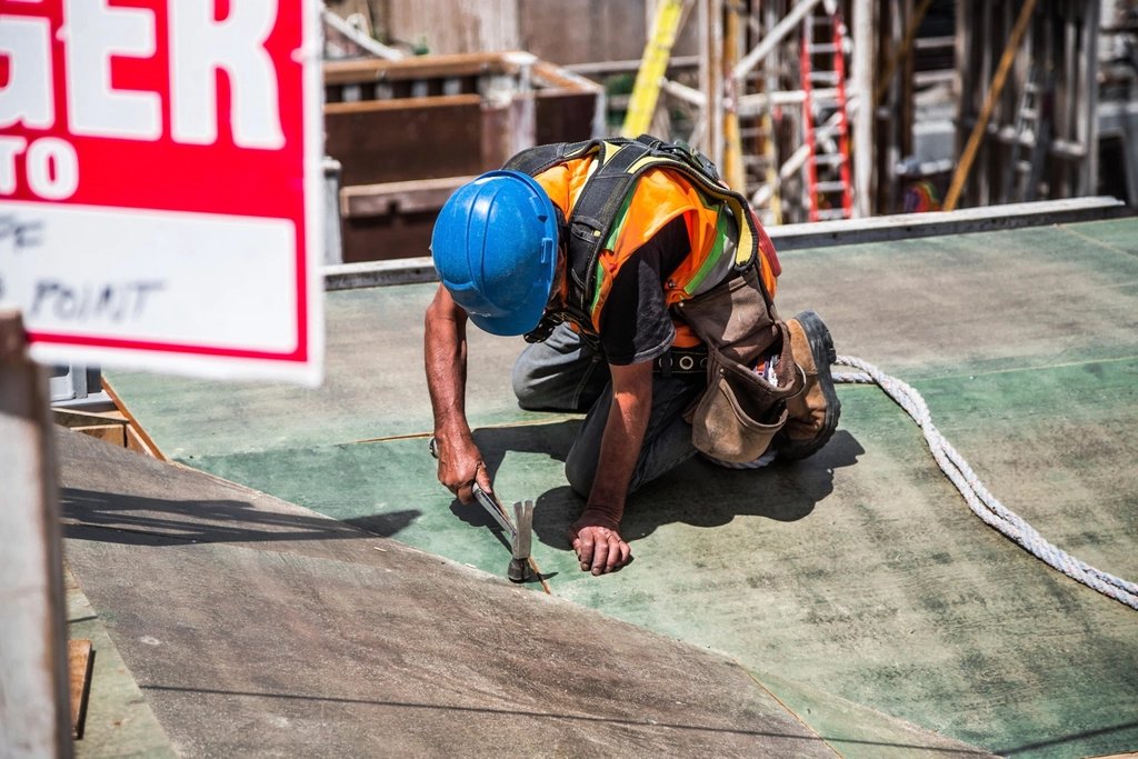 Construction worker wearing safety gear on site